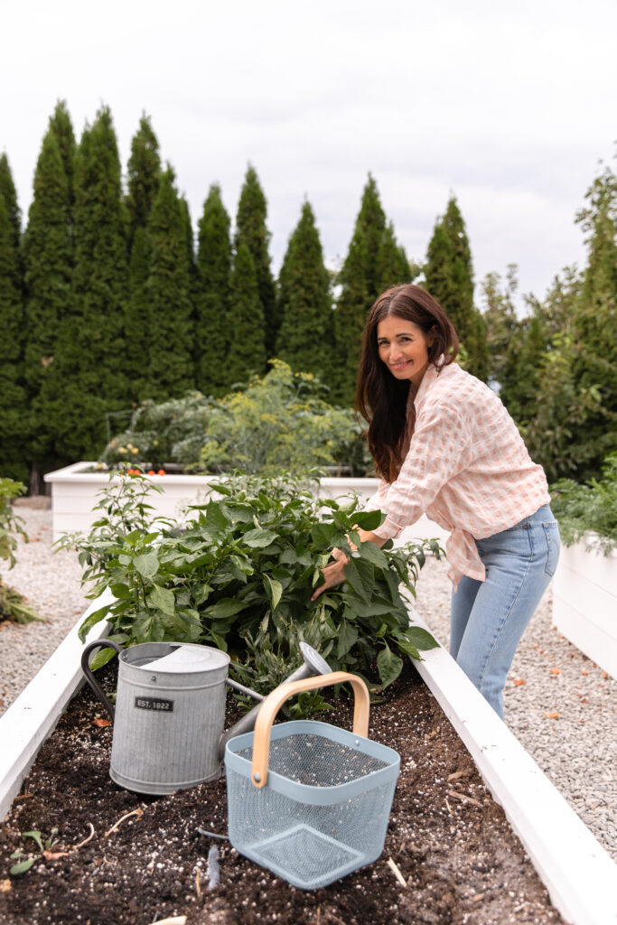 Tori planting in her vegetable garden