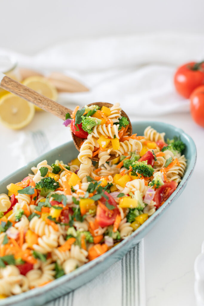 primavera pasta salad in a bowl with vibrant vegetables