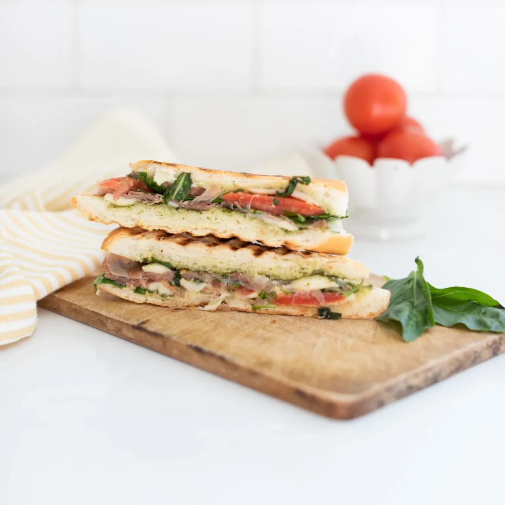 a stack of caprese paninis