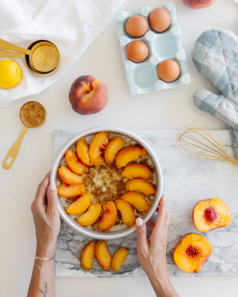 Layering peaches in pan for peach Upside Down Cake