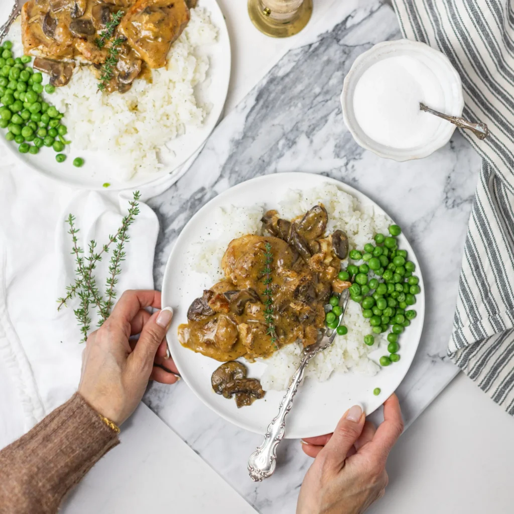 Fraiche Table Slow Cooker Pork Chops on a plate with peas