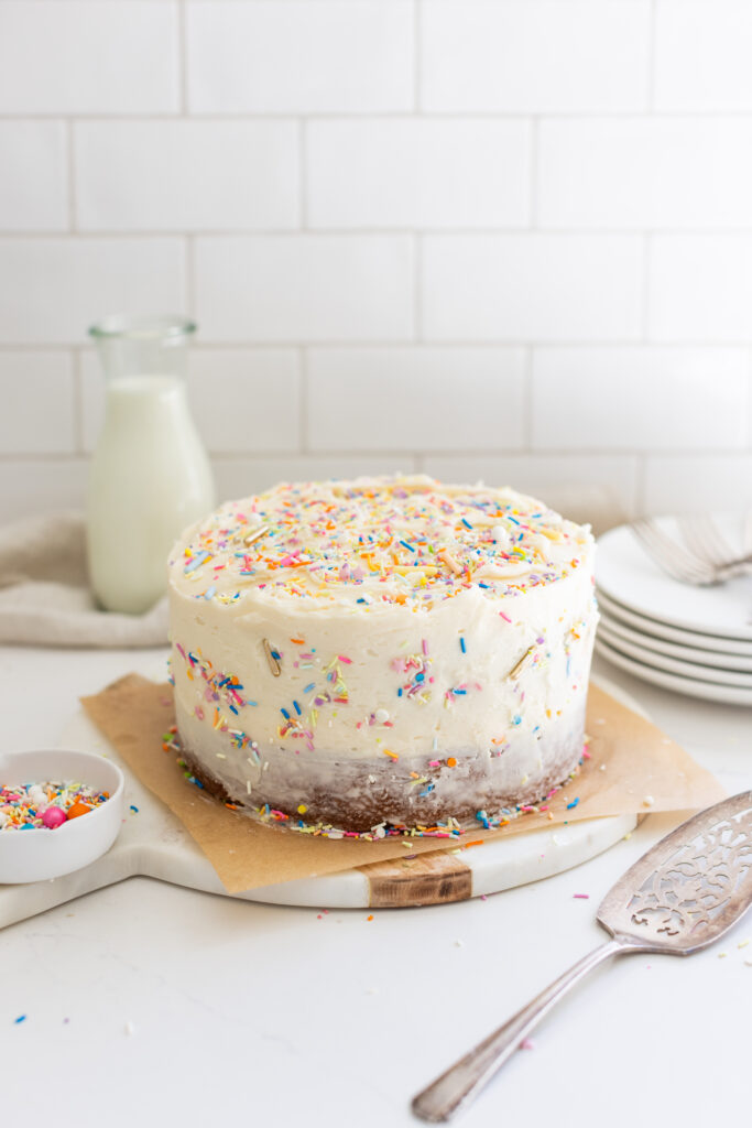 The Perfect Vanilla Cake decorated with colourful sprinkles on top