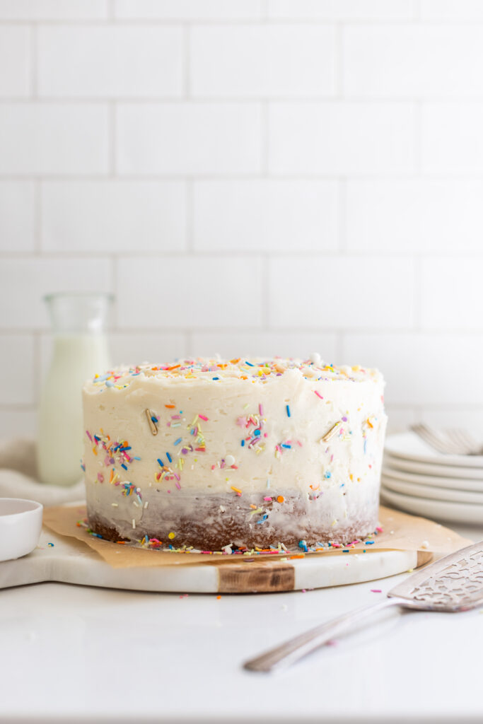 The Perfect Vanilla Cake decorated with colourful sprinkles on top