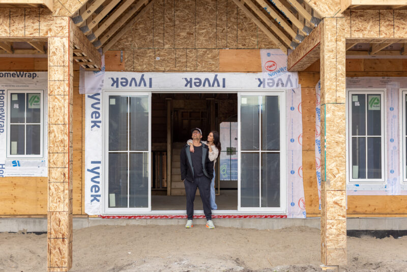 Tori and Charles - her husband and builder, outside newest build
